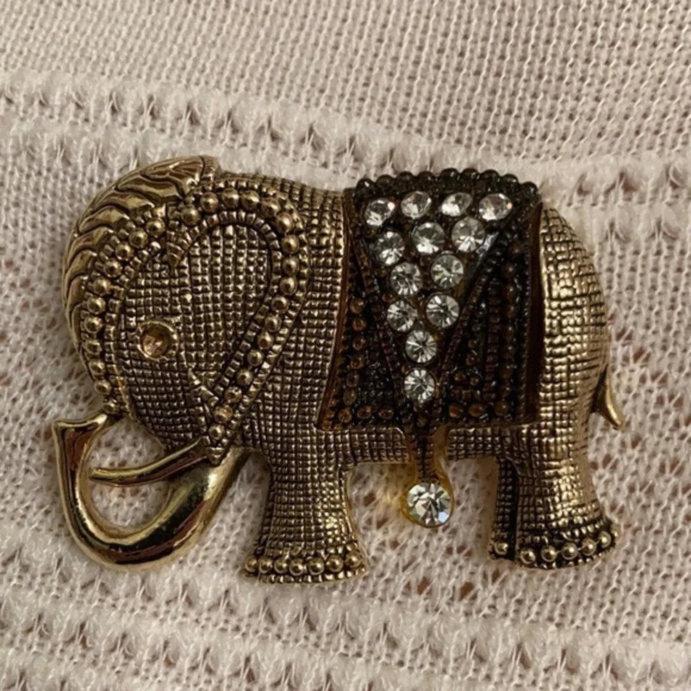 Gorgeous gold tone and crystal elephant brooch